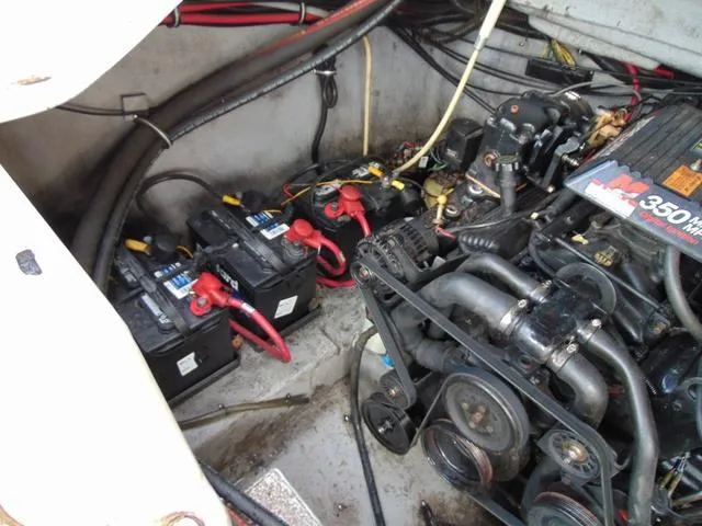 Slide: The Image of Engine compartment of a 2001 Chaparral 280SSi boat, featuring batteries and a 350 MAG engine. - 20