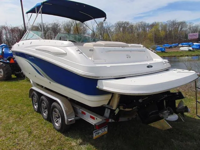 Slide: The Image of 2001 Chaparral 280SSi boat on trailer, blue and white, parked on grass. - 3