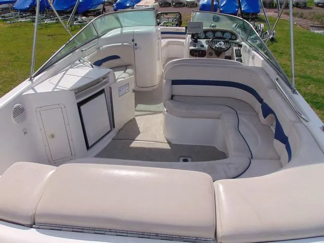 Slide: The Image of 2001 Chaparral 280SSi boat interior with white seating and dashboard. - 6