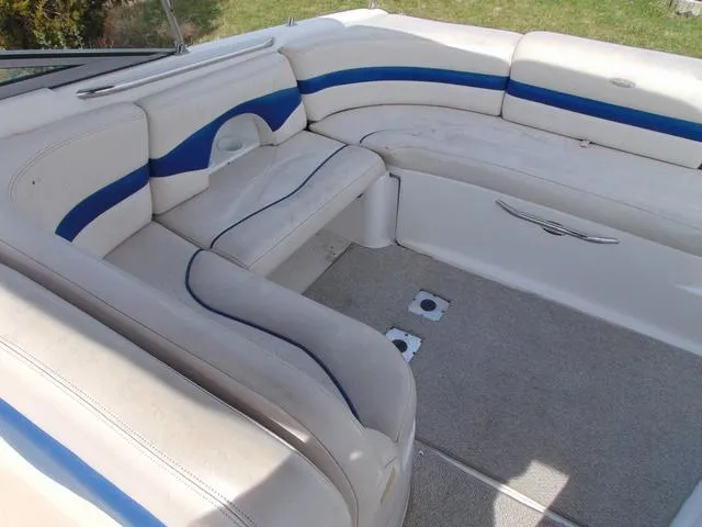 Slide: The Image of 2001 Chaparral 280SSi boat interior with white and blue seating. - 8