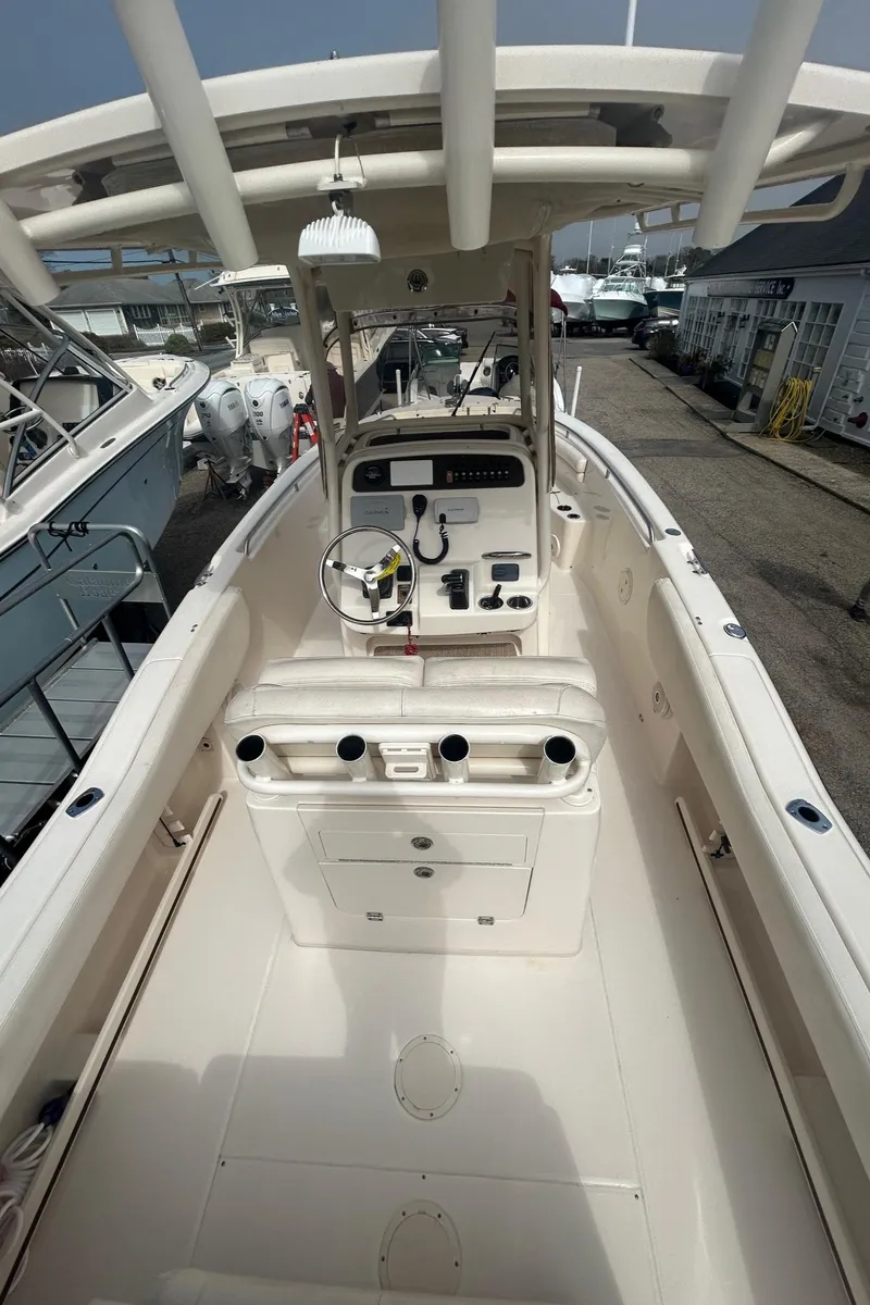 Slide: The Image of 2015 Grady-White Fisherman 257 boat interior with helm and seating. - 10