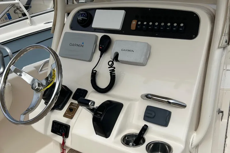 Slide: The Image of 2015 Grady-White Fisherman 257 boat interior with steering console and seating. - 13