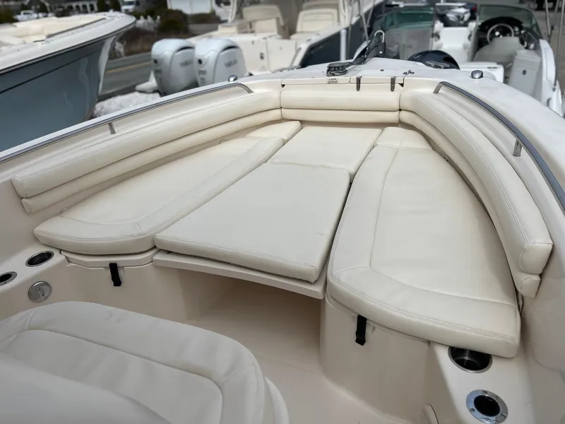 Slide: The Image of 2015 Grady-White Fisherman 257 boat interior with cushioned seating and cup holders. - 18