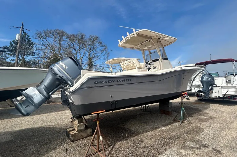 Slide: The Image of 2015 Grady-White Fisherman 257 boat on display, parked on stands outdoors. - 4