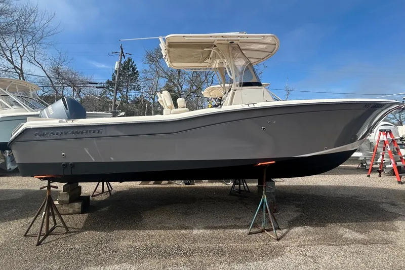 Slide: The Image of 2015 Grady-White Fisherman 257 boat on stands, parked outdoors. - 5