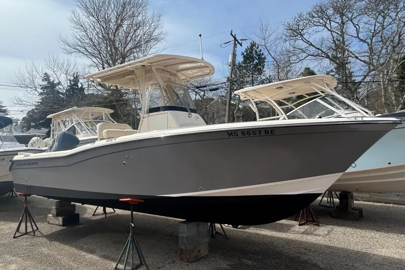 Slide: The Image of 2015 Grady-White Fisherman 257 boat on stands, featuring Yamaha outboard motor. - 6