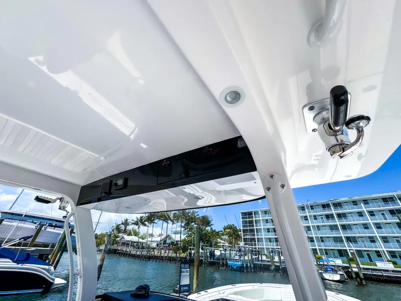 Slide: The Image of 2025 Edgewater 370CC boat interior with marina view, featuring sleek design and modern amenities. - 32