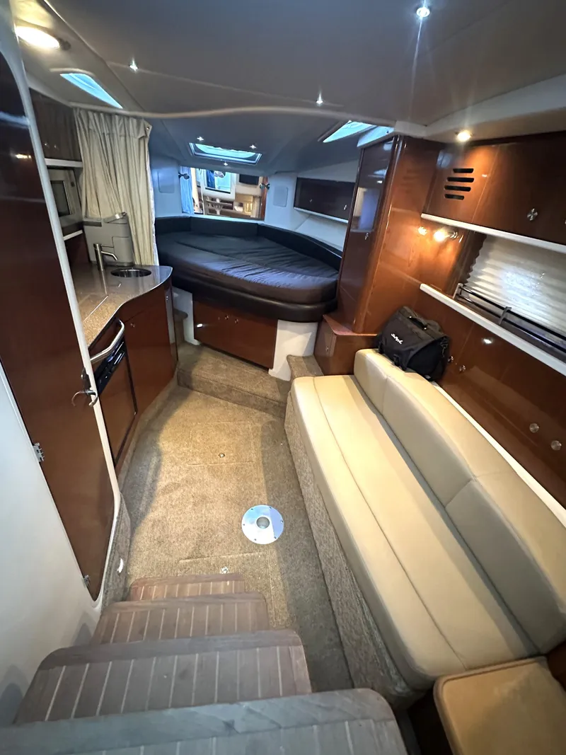 Slide: The Image of Interior of 2014 Sea Ray 330 Sundancer with cozy seating and modern amenities. - 19