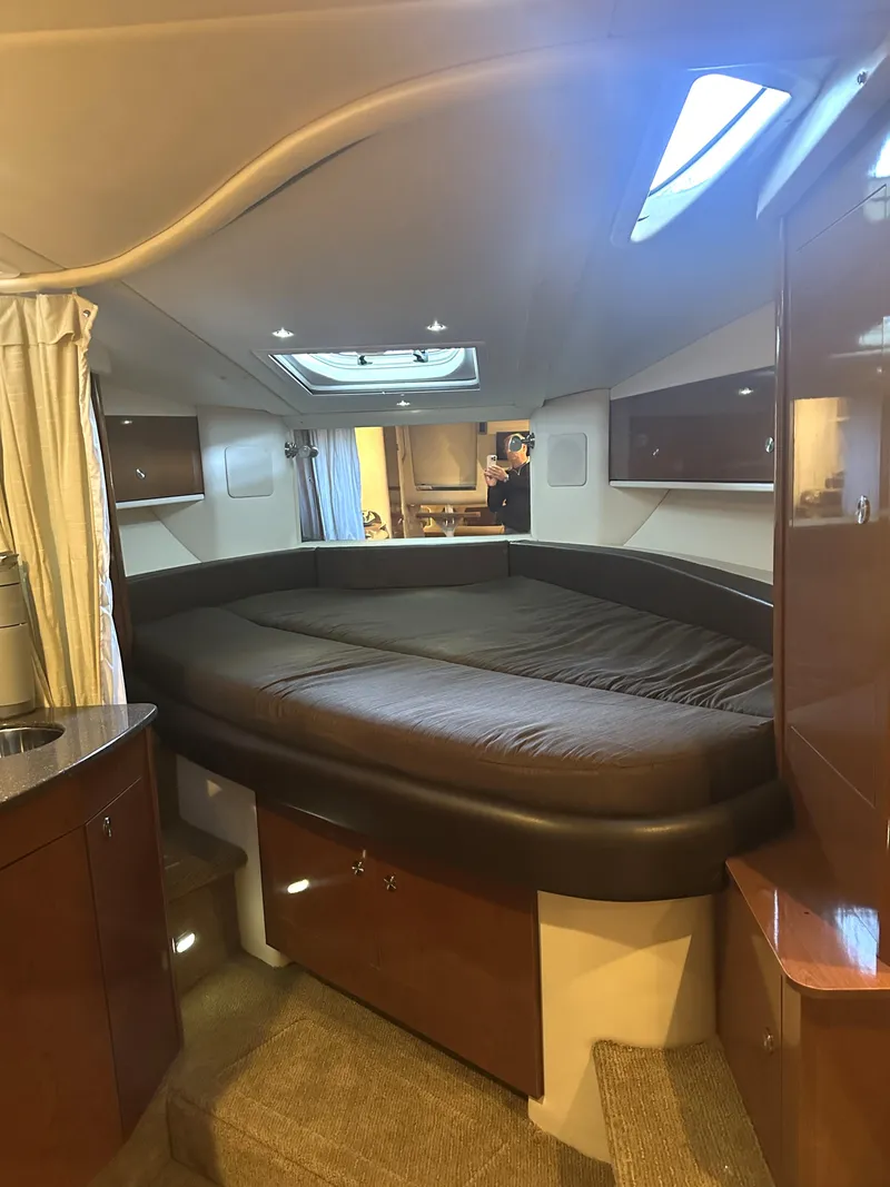 Slide: The Image of Interior cabin of 2014 Sea Ray 330 Sundancer with cozy bed and modern design. - 21