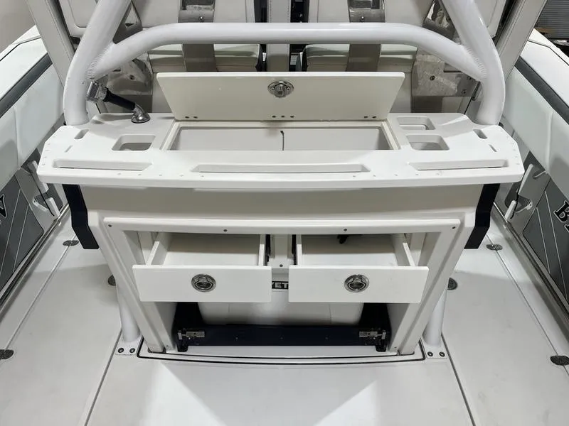 Slide: The Image of 2019 Blackfin 272 CC boat interior with storage compartments and seating. - 11