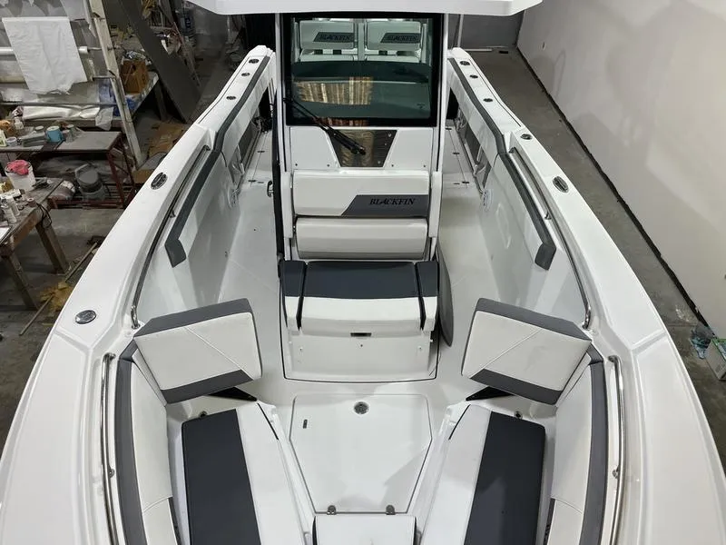 Slide: The Image of 2019 Blackfin 272 CC boat interior with seating and storage compartments. - 18