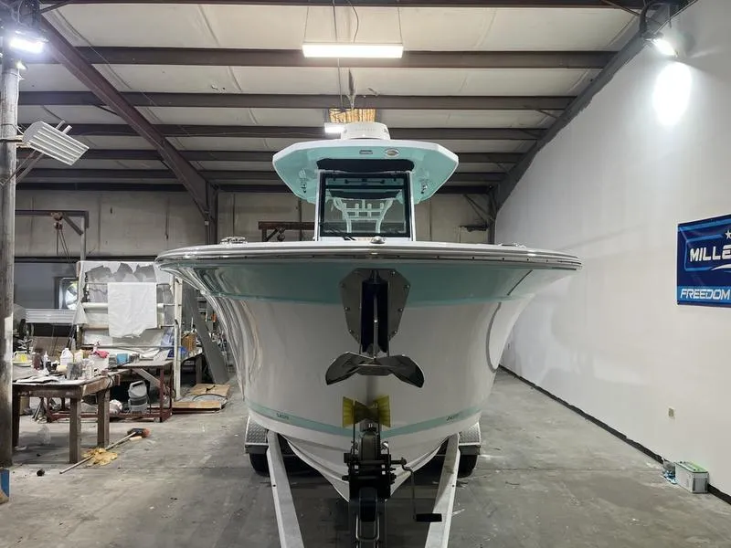 Slide: The Image of 2019 Blackfin 272 CC boat in a workshop, front view. - 2