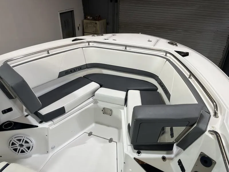 Slide: The Image of 2019 Blackfin 272 CC boat interior with cushioned seating and sleek design. - 20