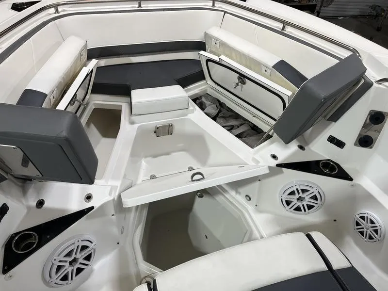 Slide: The Image of 2019 Blackfin 272 CC boat interior with seating and storage compartments. - 21