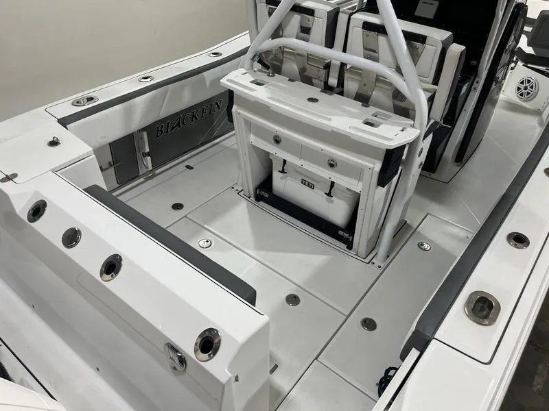 Slide: The Image of 2019 Blackfin 272 CC boat interior with seating and storage compartments. - 7