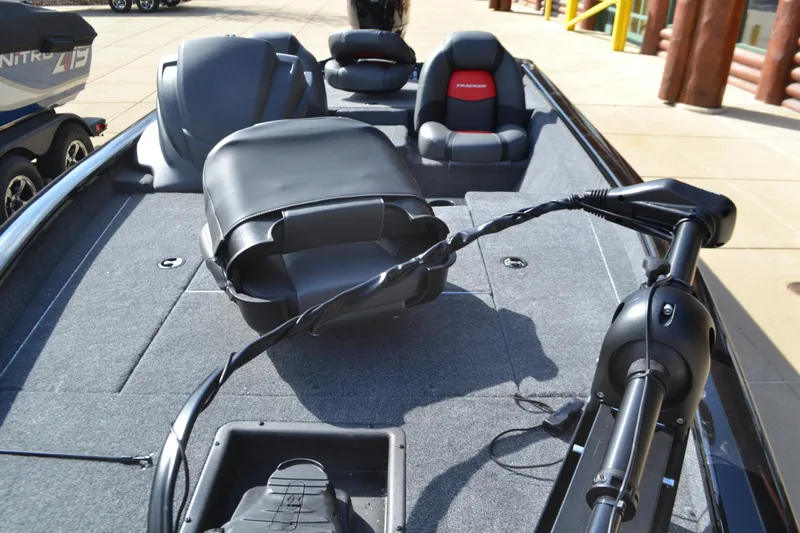 Slide: The Image of 2025 Tracker Pro Team 175 boat interior with seating and trolling motor. - 3