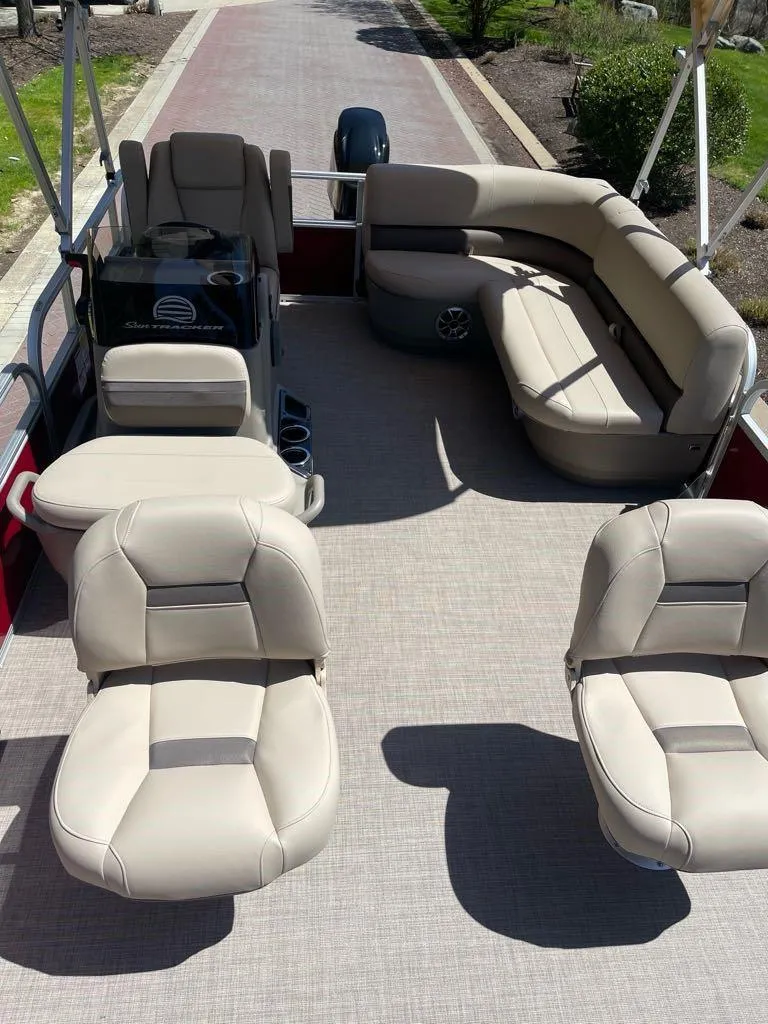 Slide: The Image of 2025 Sun Tracker Bass Buggy 16 XL Select pontoon boat with spacious seating and modern design. - 4