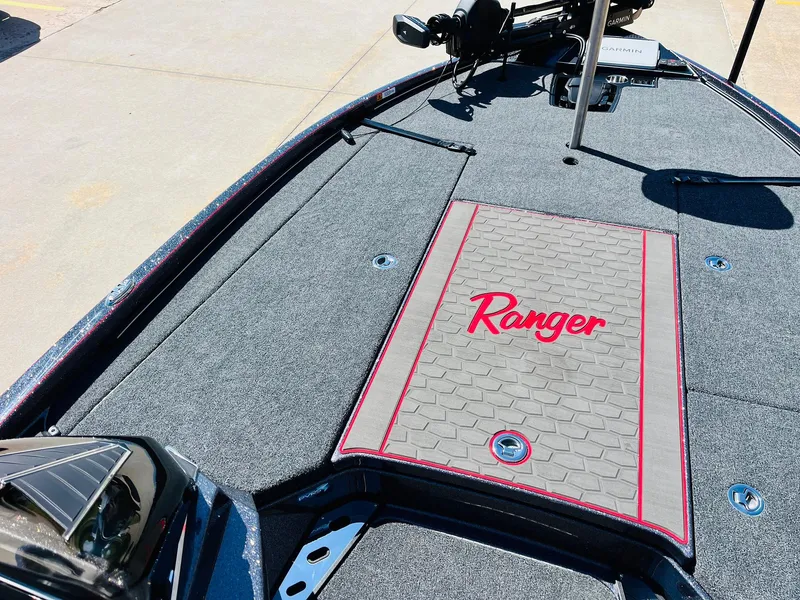 Slide: The Image of 2025 Ranger Z521R Cup-Equipped boat deck with logo and carpeted surface. - 13