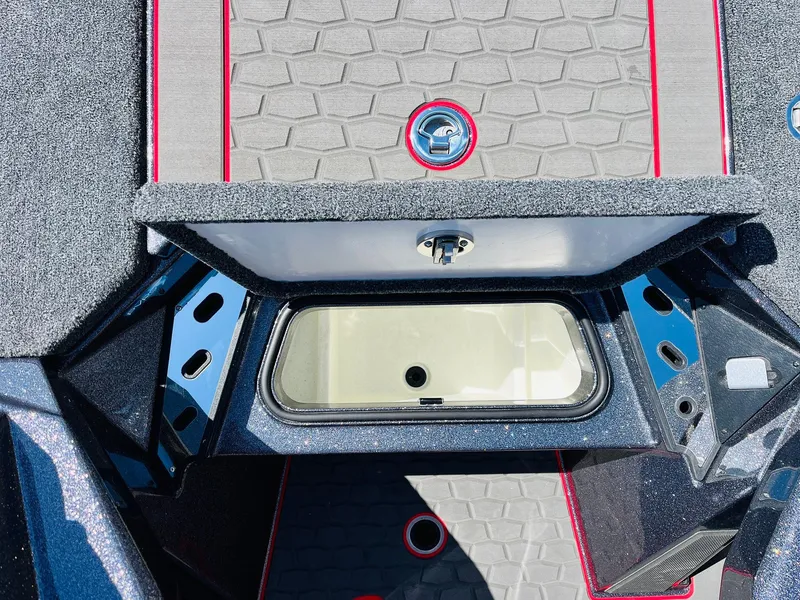 Slide: The Image of 2025 Ranger Z521R Cup-Equipped boat interior with storage compartment and sleek design. - 25