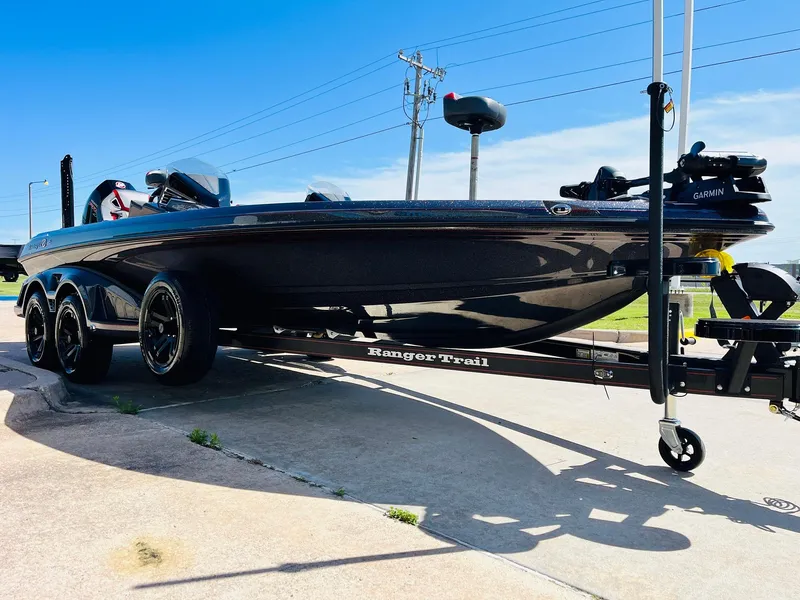 Slide: The Image of 2025 Ranger Z521R Cup-Equipped boat on trailer, sleek design, parked outdoors. - 3