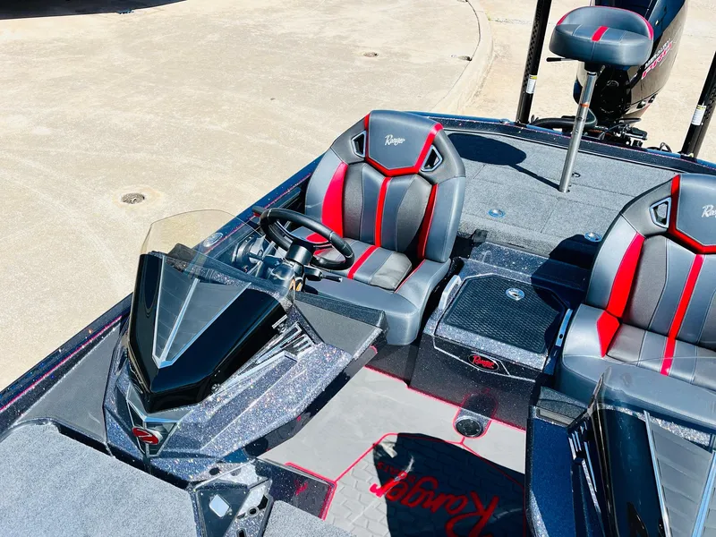 Slide: The Image of 2025 Ranger Z521R Cup-Equipped boat interior with sleek seats and modern dashboard. - 30