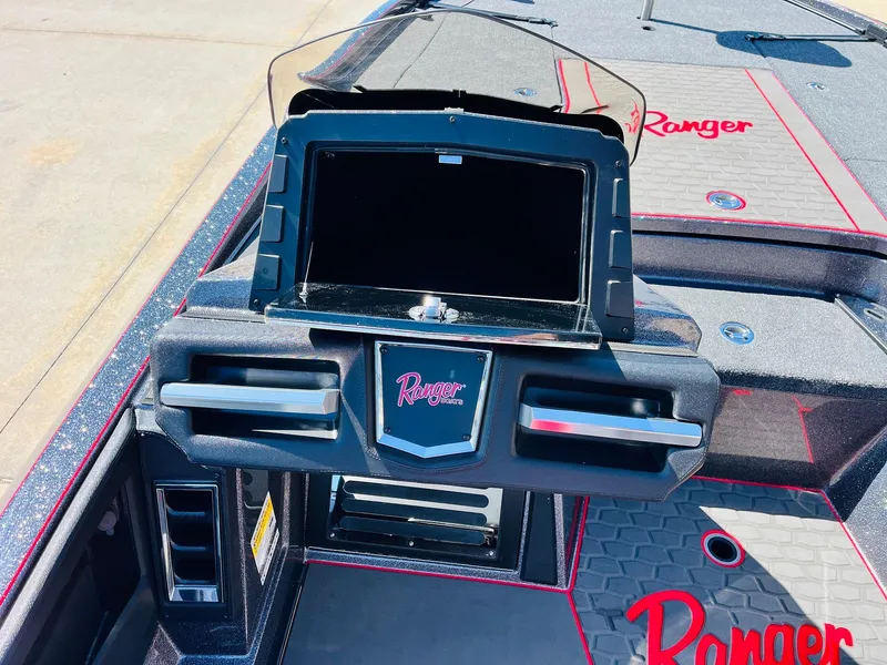 Slide: The Image of 2025 Ranger Z521R Cup-Equipped boat dashboard with storage compartment and logo detailing. - 33