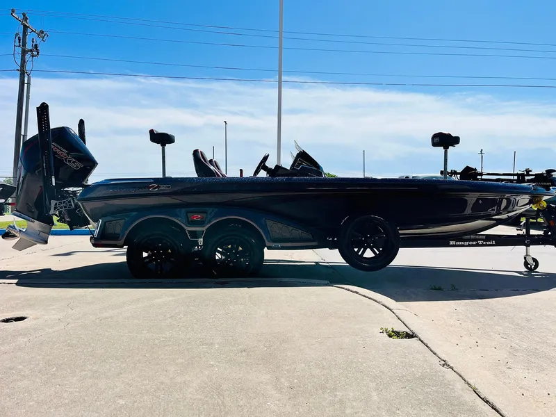 Slide: The Image of 2025 Ranger Z521R Cup-Equipped boat on trailer, sleek design, parked outdoors. - 4