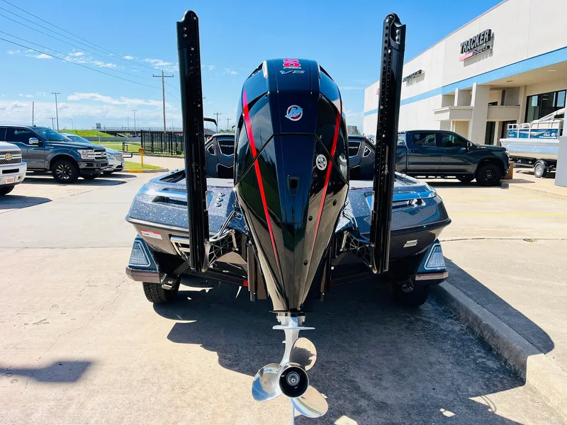 Slide: The Image of 2025 Ranger Z521R Cup-Equipped boat with powerful outboard motor, parked outdoors. - 6