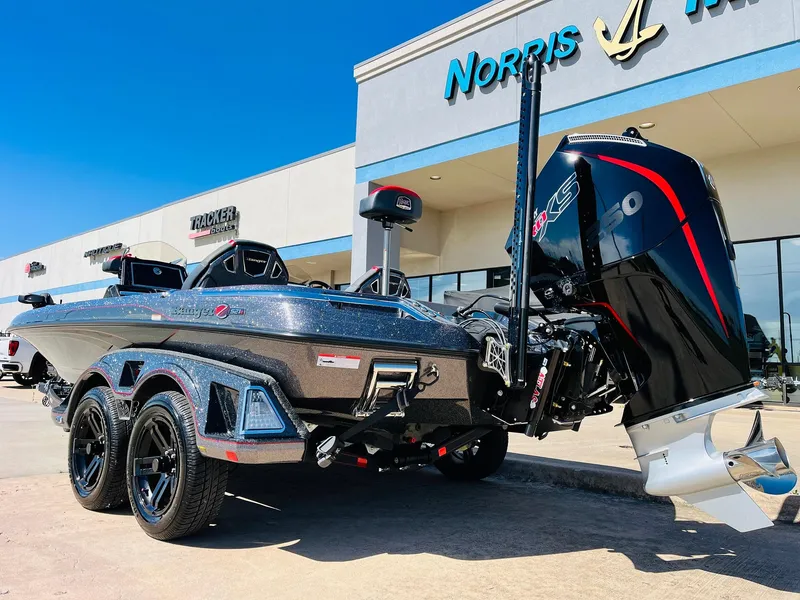 Slide: The Image of 2025 Ranger Z521R Cup-Equipped boat with powerful engine, parked outside dealership. - 7