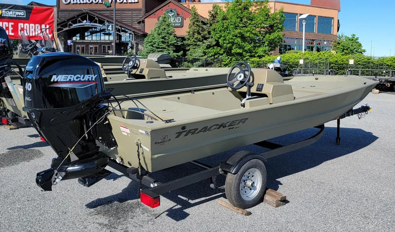 Slide: The Image of 2025 Tracker Grizzly 1648 SC boat with Mercury engine on a trailer. - 2