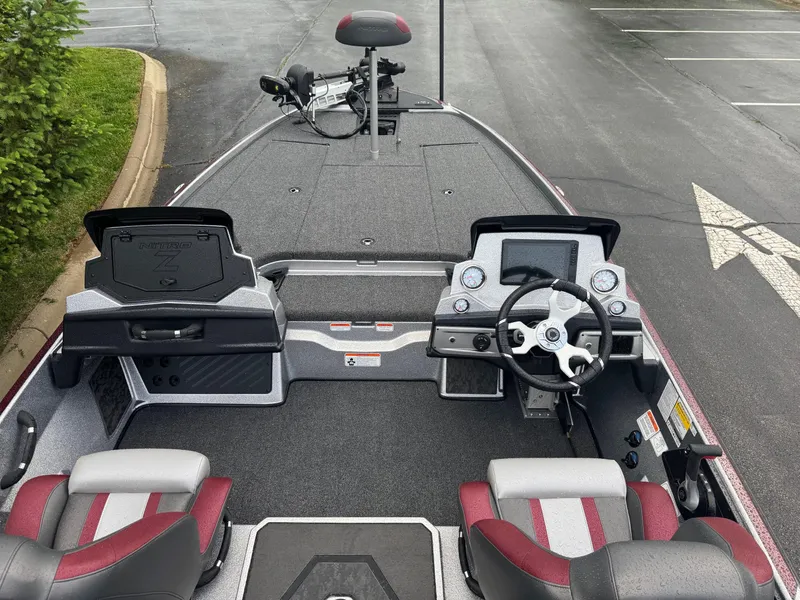 Slide: The Image of 2025 Nitro Z20 XL Pro boat interior with steering console and seating. - 3