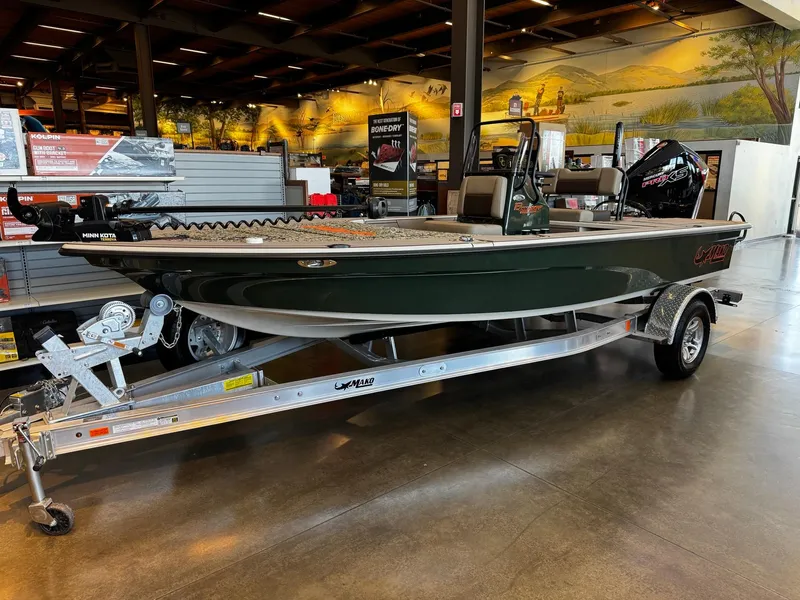 The Image of 2025 Mako 18 Pro Skiff Backwater Edition on display in a showroom. - 0