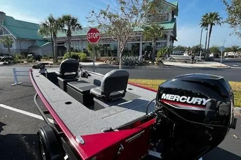 Slide: The Image of 2025 Tracker Panfish 17 boat with Mercury engine in parking lot. - 2