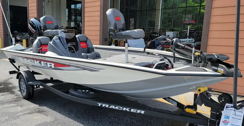Slide: The Image of 2025 Tracker Pro Team 175 boat displayed outdoors, featuring sleek design and modern seating. - 3