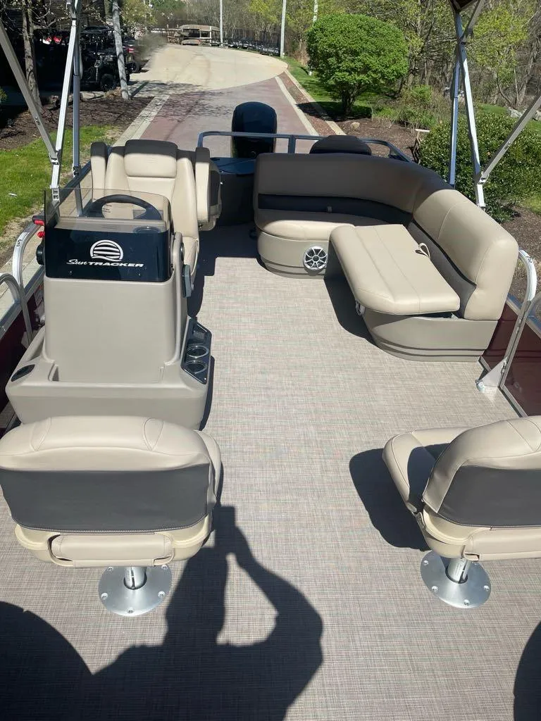 Slide: The Image of 2025 Sun Tracker Bass Buggy 18 DLX pontoon boat with spacious seating and modern design. - 4