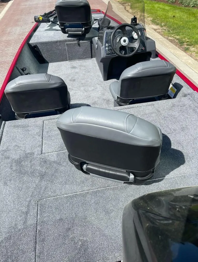 Slide: The Image of 2025 Tracker Bass Tracker Classic XL interior with gray seating and steering console. - 5