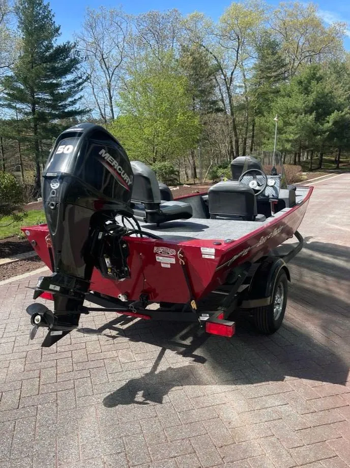 Slide: The Image of 2025 Tracker Bass Tracker Classic XL boat with Mercury engine on a sunny day. - 6