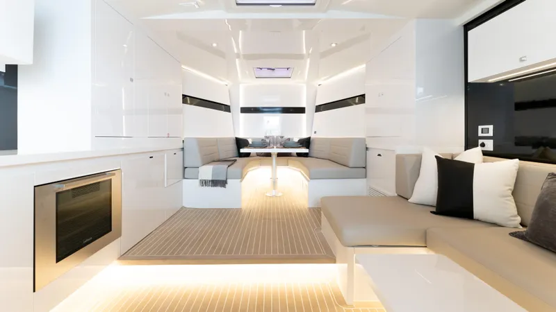 Slide: The Image of Luxurious interior of 2024 VanDutch 56 yacht with modern seating and ambient lighting. - 10