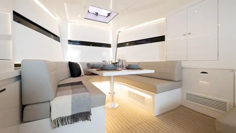 Slide: The Image of Luxurious interior of 2024 VanDutch 56 yacht with elegant dining area and modern design. - 11