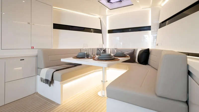 Slide: The Image of Luxurious interior of 2024 VanDutch 56 yacht with elegant dining area and modern design. - 12