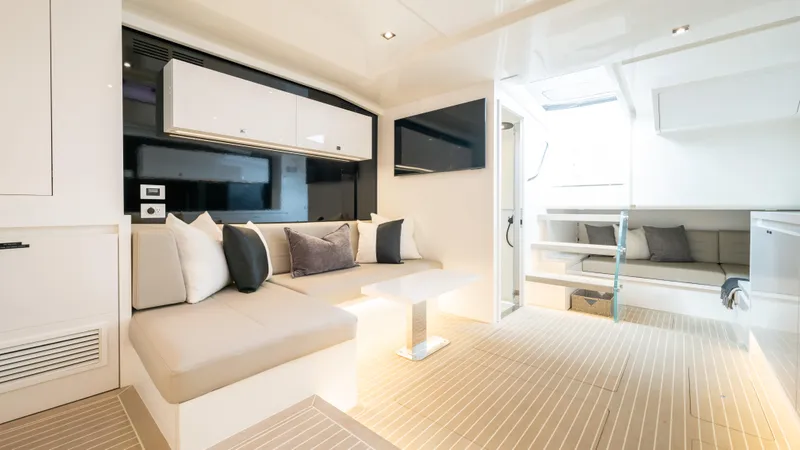 Slide: The Image of Luxurious interior of 2024 VanDutch 56 yacht with modern seating and elegant design. - 15