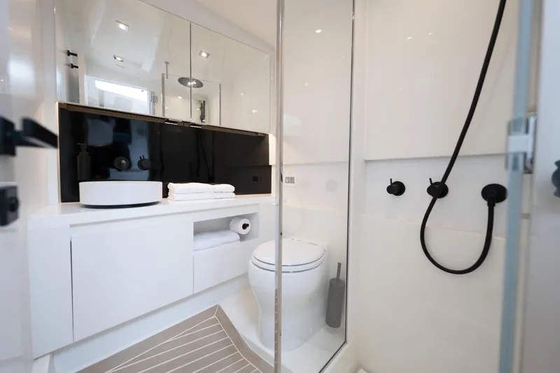 Slide: The Image of Luxurious bathroom interior of 2024 VanDutch 56 yacht, featuring modern fixtures and sleek design. - 16