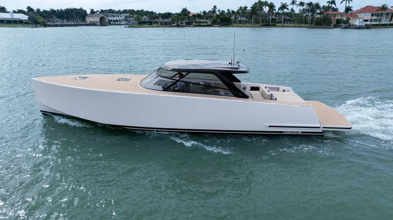 Slide: The Image of 2024 VanDutch 56 yacht cruising on a serene waterway, showcasing sleek design and luxury. - 3