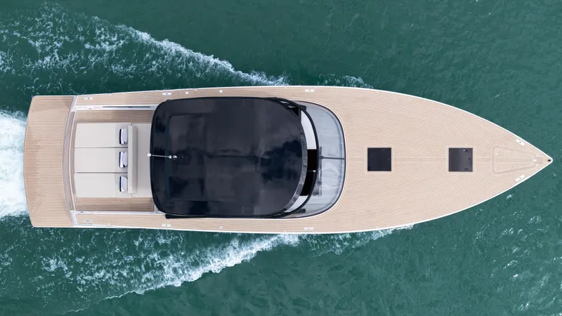Slide: The Image of Top view of 2024 VanDutch 56 yacht cruising on water. - 5