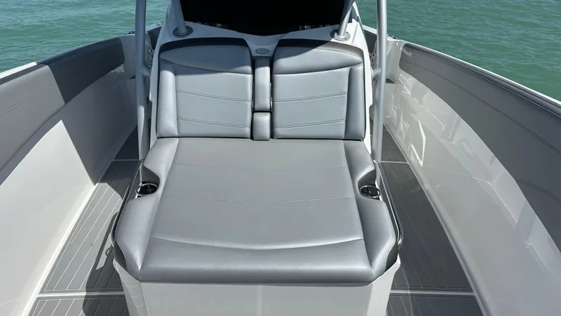 Slide: The Image of 2018 Nor-Tech 340 Sport Center Console boat with sleek gray seating. - 15