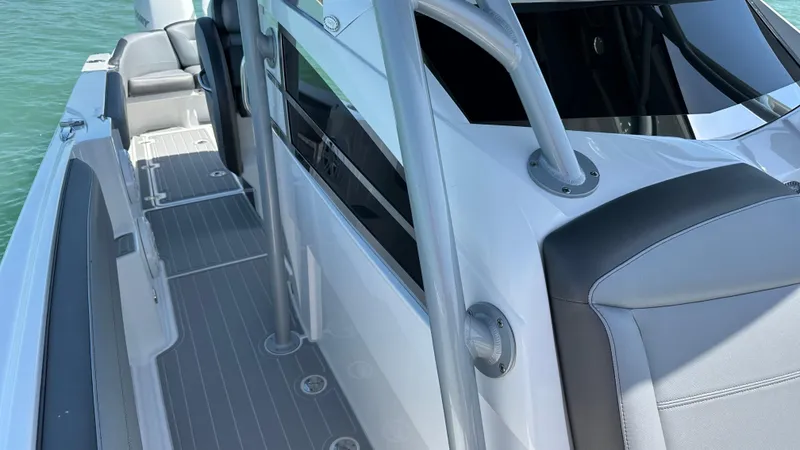 Slide: The Image of 2018 Nor-Tech 340 Sport Center Console boat with sleek design and modern features. - 18