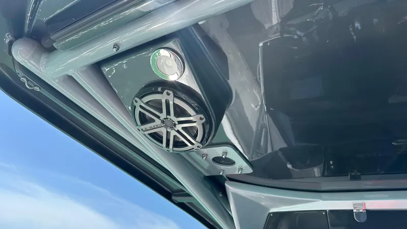 Slide: The Image of Speaker system on 2018 Nor-Tech 340 Sport Center Console boat, under blue sky. - 24