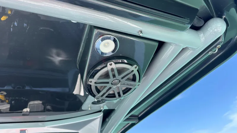 Slide: The Image of 2018 Nor-Tech 340 Sport Center Console speaker and light detail under canopy. - 25
