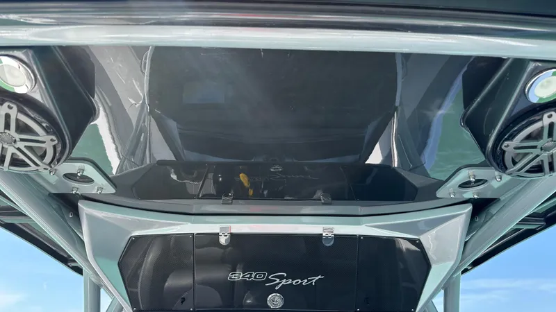 Slide: The Image of 2018 Nor-Tech 340 Sport Center Console boat with sleek design and modern audio system. - 26