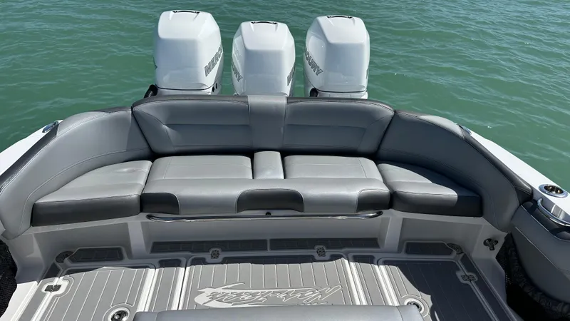Slide: The Image of 2018 Nor-Tech 340 Sport Center Console with triple engines and spacious seating. - 33